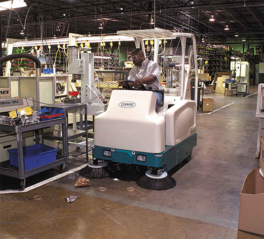 6200 Compact Rider Sweeper in a manufacturing plant.